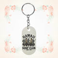 Surf Club sublimated keychain on a pale tropical background without a shadow