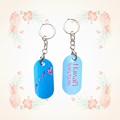 State of Hawaii double-sided keychains on a pale tropical background without a shadow