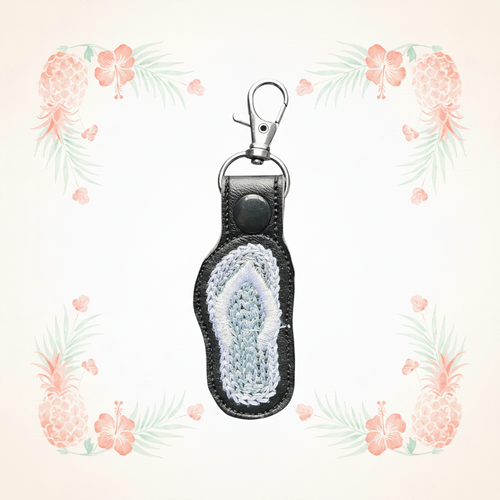 Flip flop keychain on a pale tropical background without a shadow