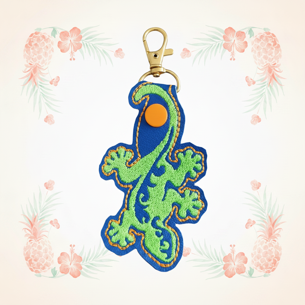 Gecko filled keychain on a pale tropical background without a shadow