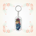White HI Vibe keychain on pale pineapple-and-palm background